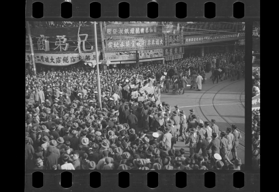 Crowd of people in Shanghai city streets. Digitized black and white photo negatives.