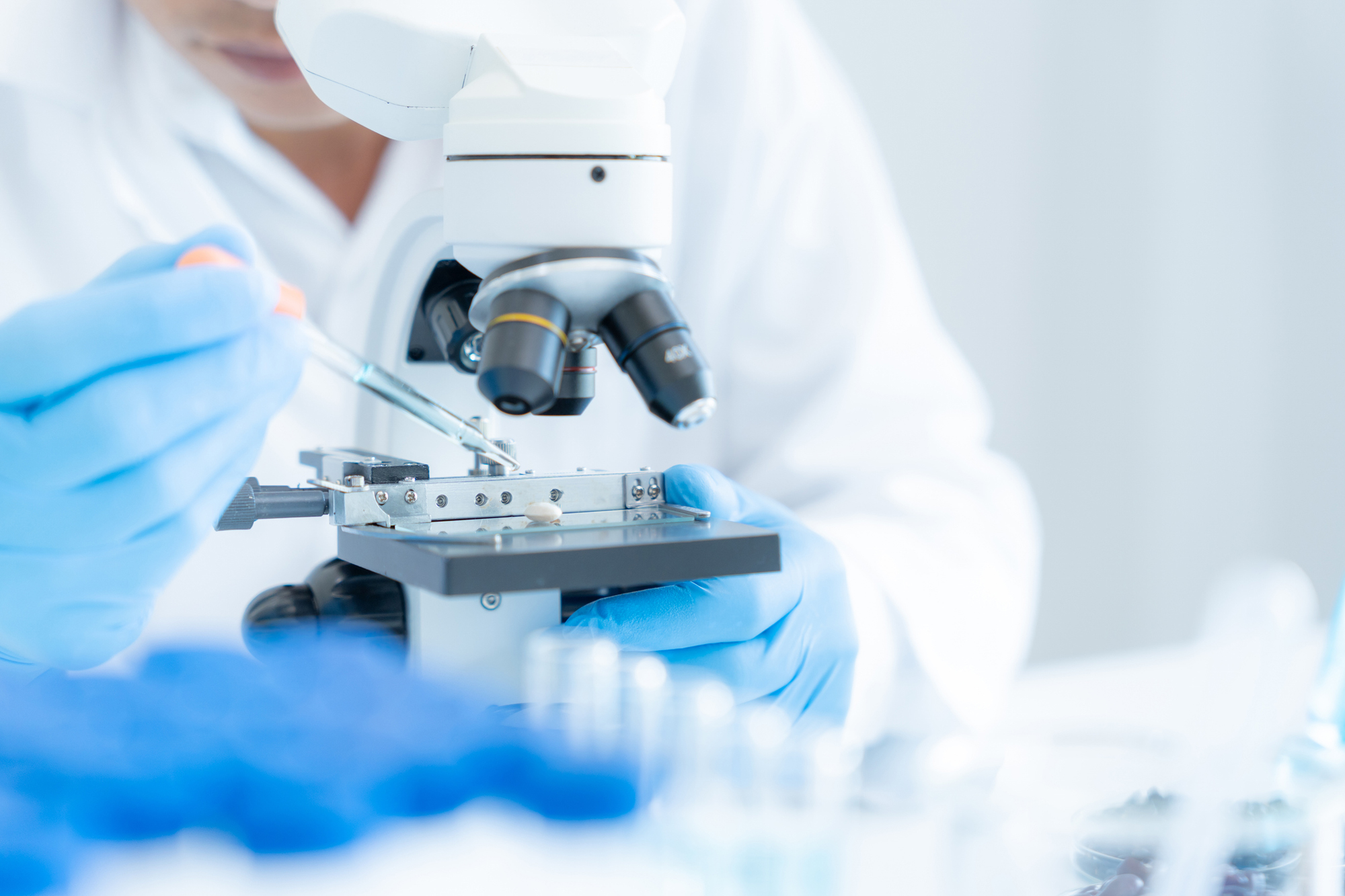 Scientist analyze biochemical samples in advanced scientific laboratory. Medical professional use microscope look microbiological developmental of viral. Biotechnology research in science lab. stock photo