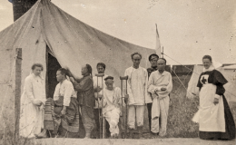 A Red Cross hospital tent filled with injured and recovering patients is shown in one of the photographs