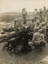 Members of an anti-aircraft crew go through their paces