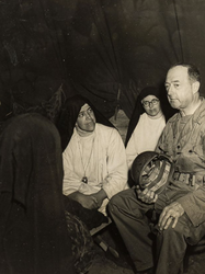 Gen Richardson speaks with native nuns at an internment camp during his inspection of the island