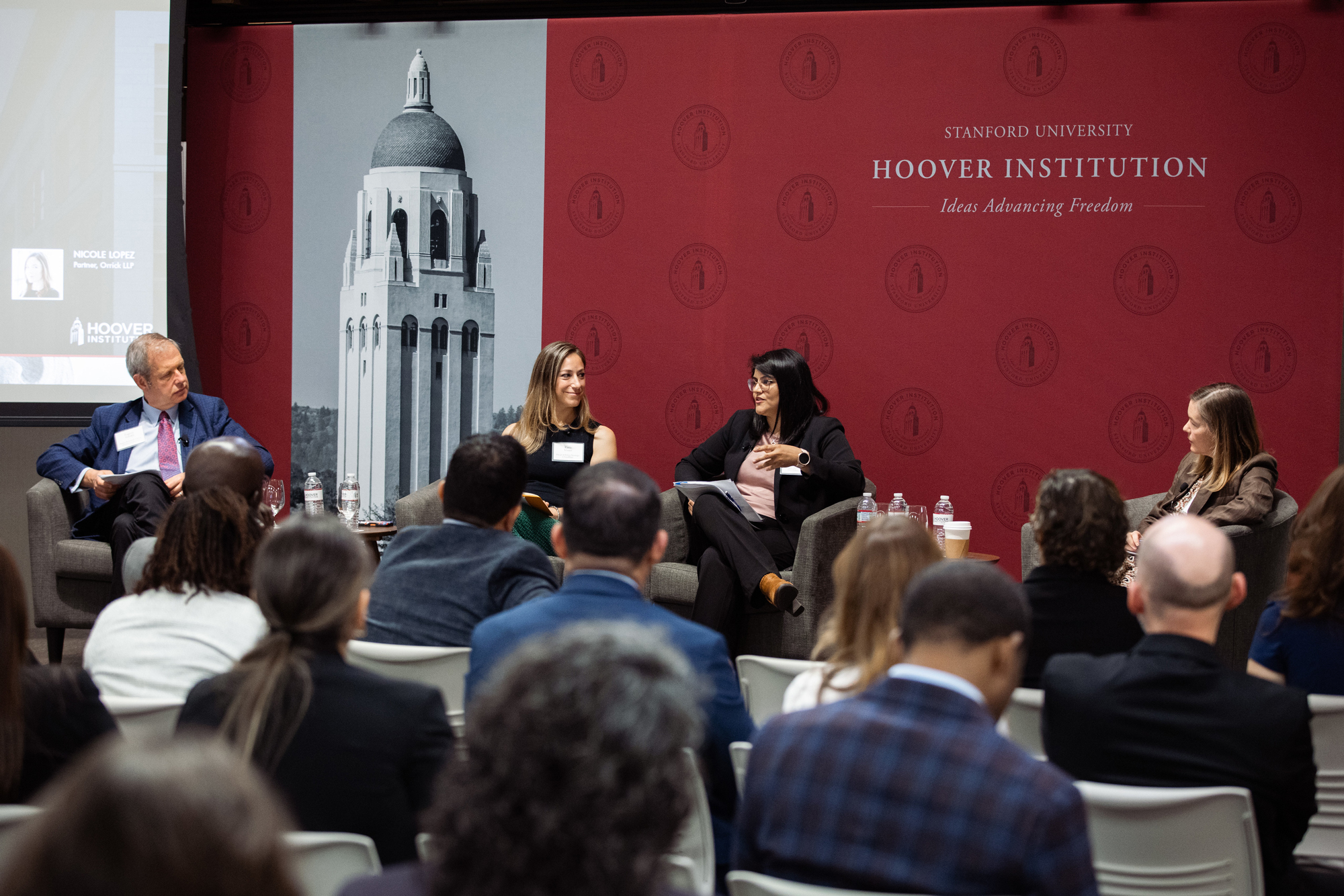 Senior Fellow Eugene Volokh (right), Katie Visser of Cloudflare, Ellie Sakahee of Google and Nicole Lopez of Orrick LLP are seen in Hoover’s Stauffer Auditorium on July 21, 2026.