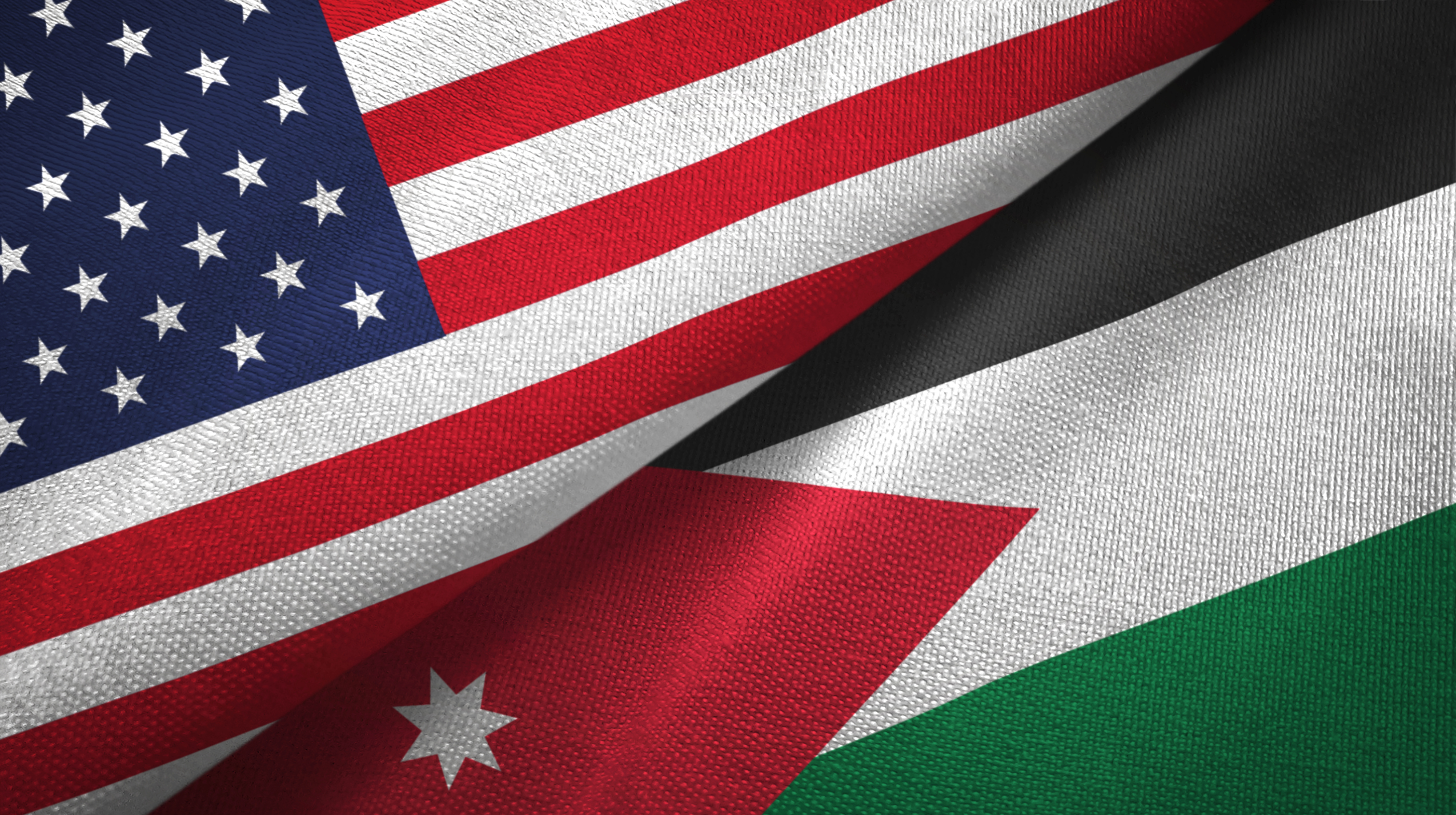 Jordan and United States two flags together textile cloth, fabric texture - stock photo