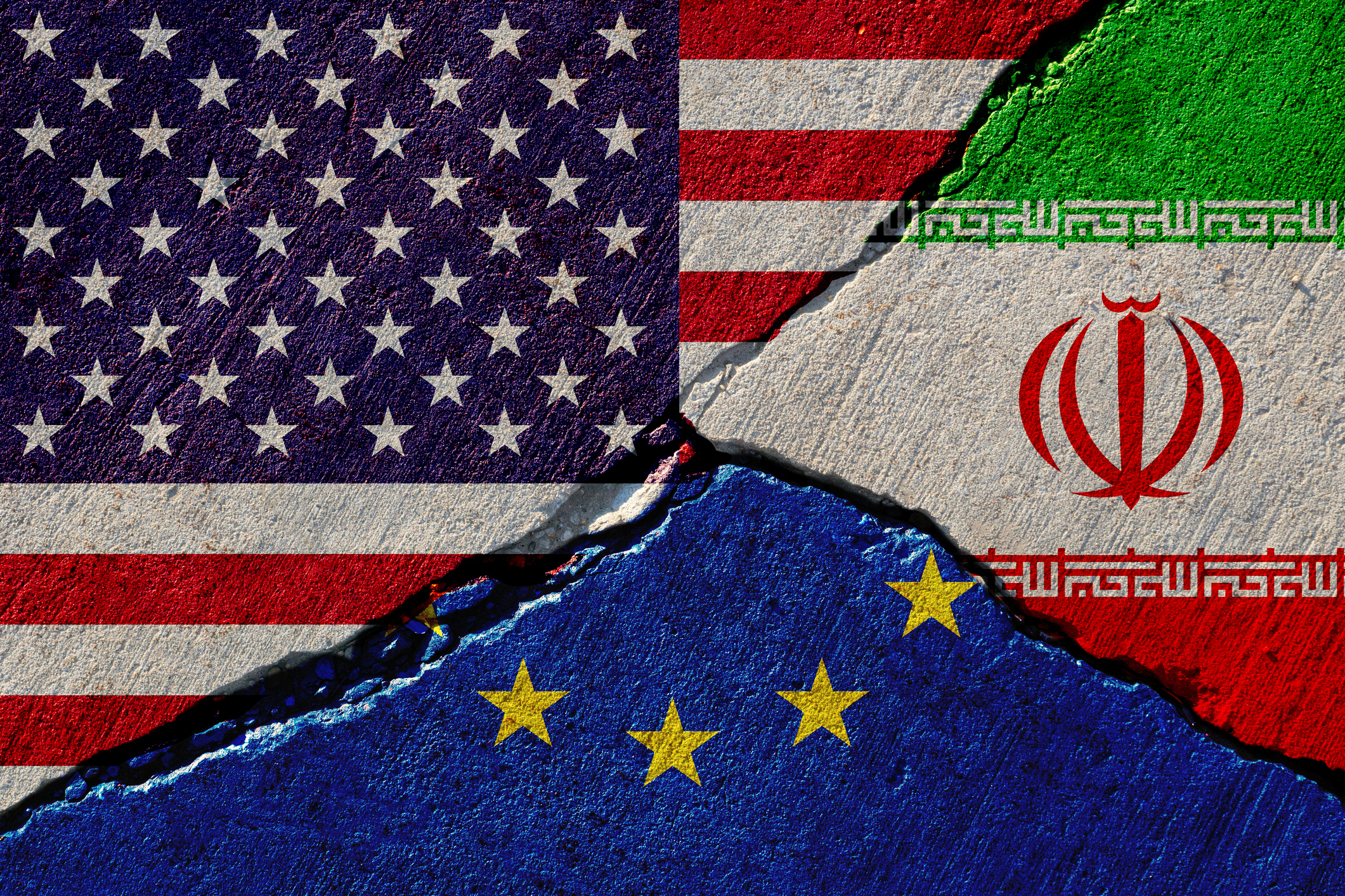 Concrete wall with painted united states, european union and iran flags stock photo