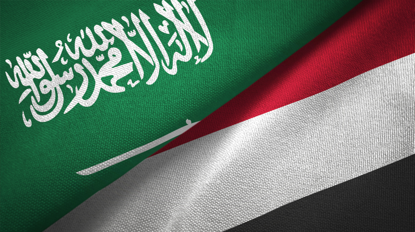 Yemen and Saudi Arabia two flags together textile cloth, fabric texture stock photo