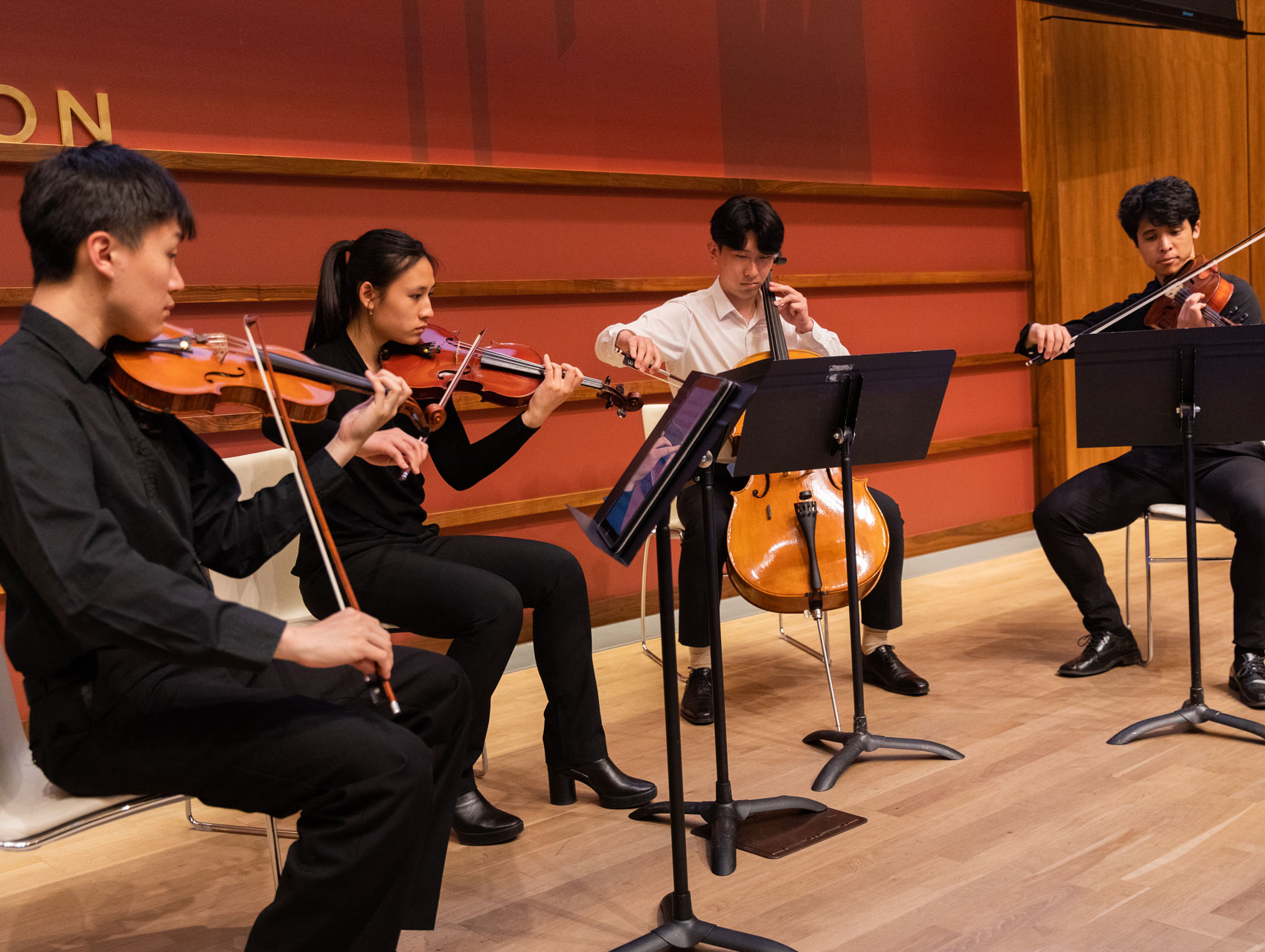 Stanford student string quartet on stage in Hauck Auditorium