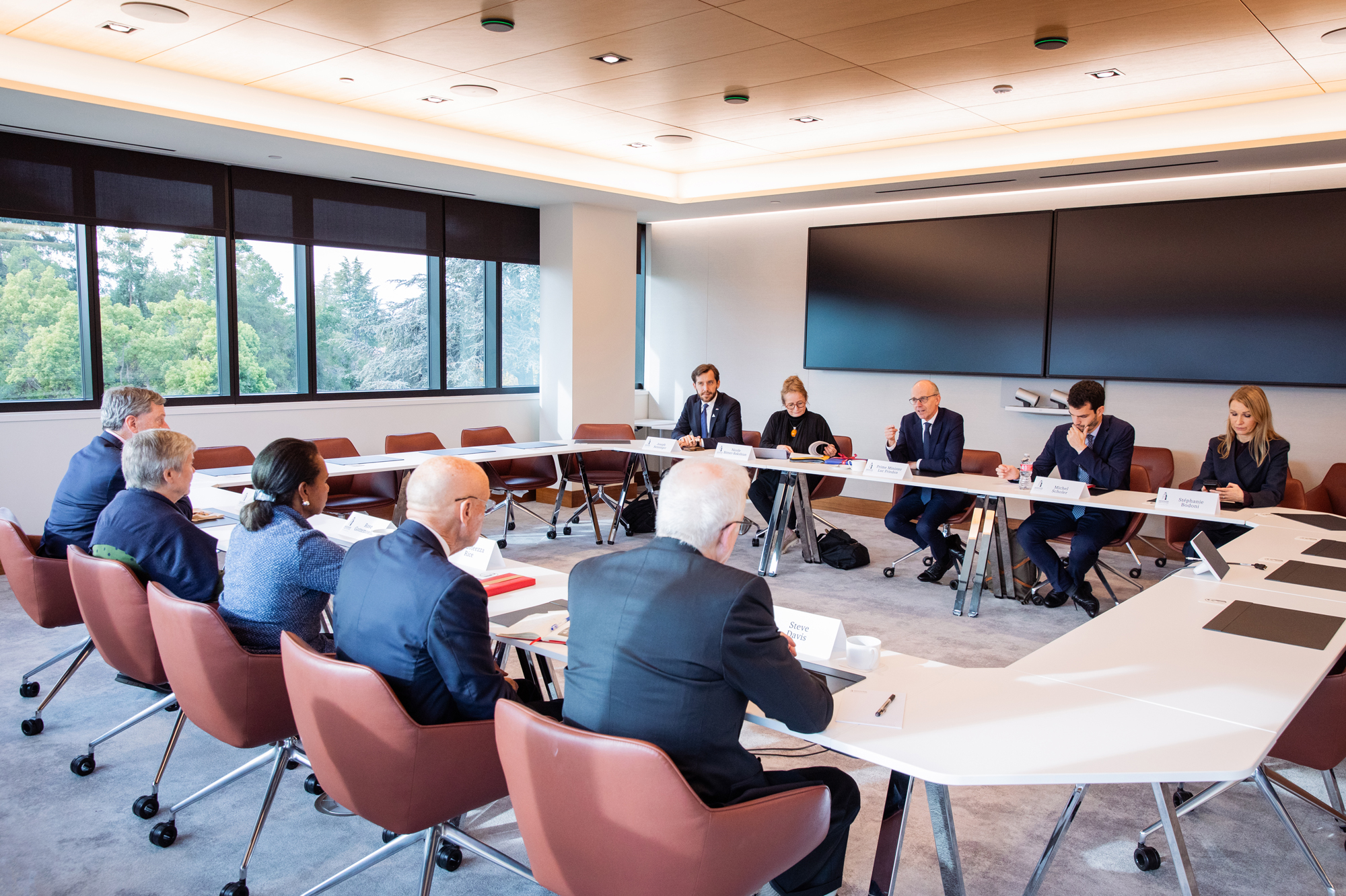 Hoover fellows (right to left) Philip Zelikow, Rose Gottemoeller, Condoleezza Rice, Adm. James O. Ellis Jr. and Steven J. Davis speak with Luxembourg Prime Minister Luc Frieden on November 11, 2025. (Patrick Beaudouin)