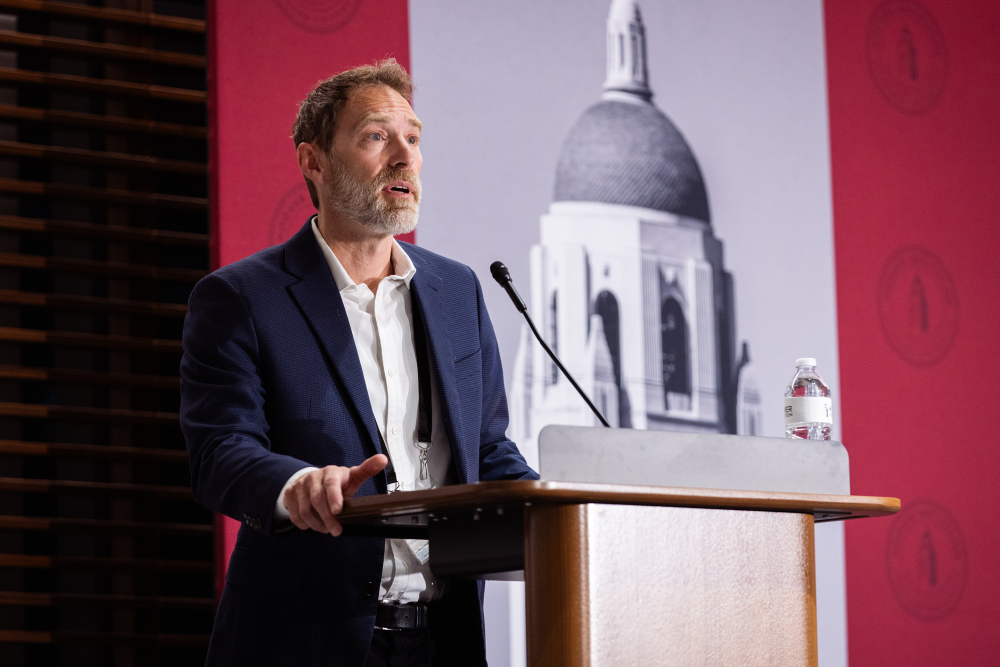 Markets vs. Mandates co-director Dominic Parker speaks in Hoover’s Shultz Auditorium on May 12, 2026. (Patrick Beaudouin)