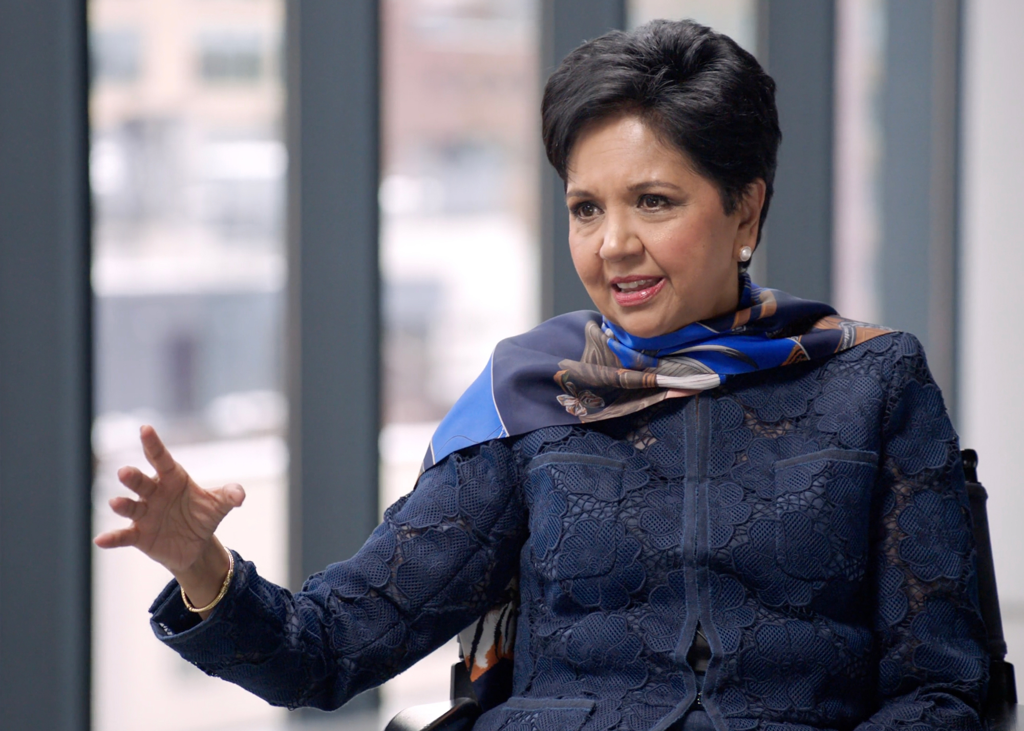 Indra Nooyi speaking to Condoleezza Rice.