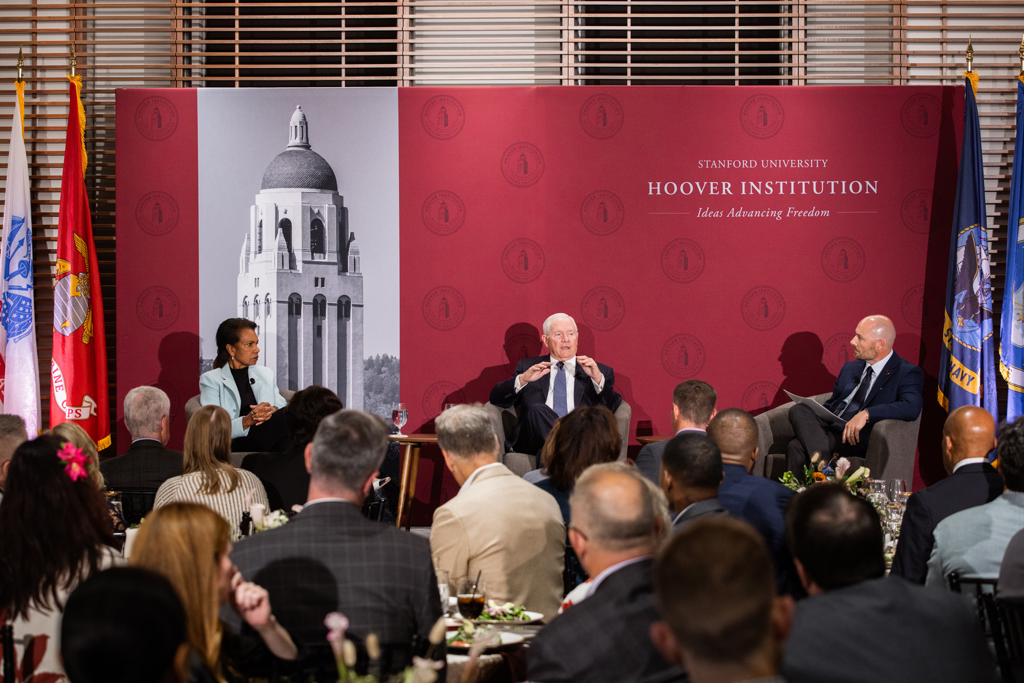 Condoleezza Rice and Robert Gates speak about their experiences in government, in a discussion moderated by Veteran Fellow Matthew Brown (right), before an audience in Shultz Auditorium on May 7, 2026. (Patrick Beaudouin)