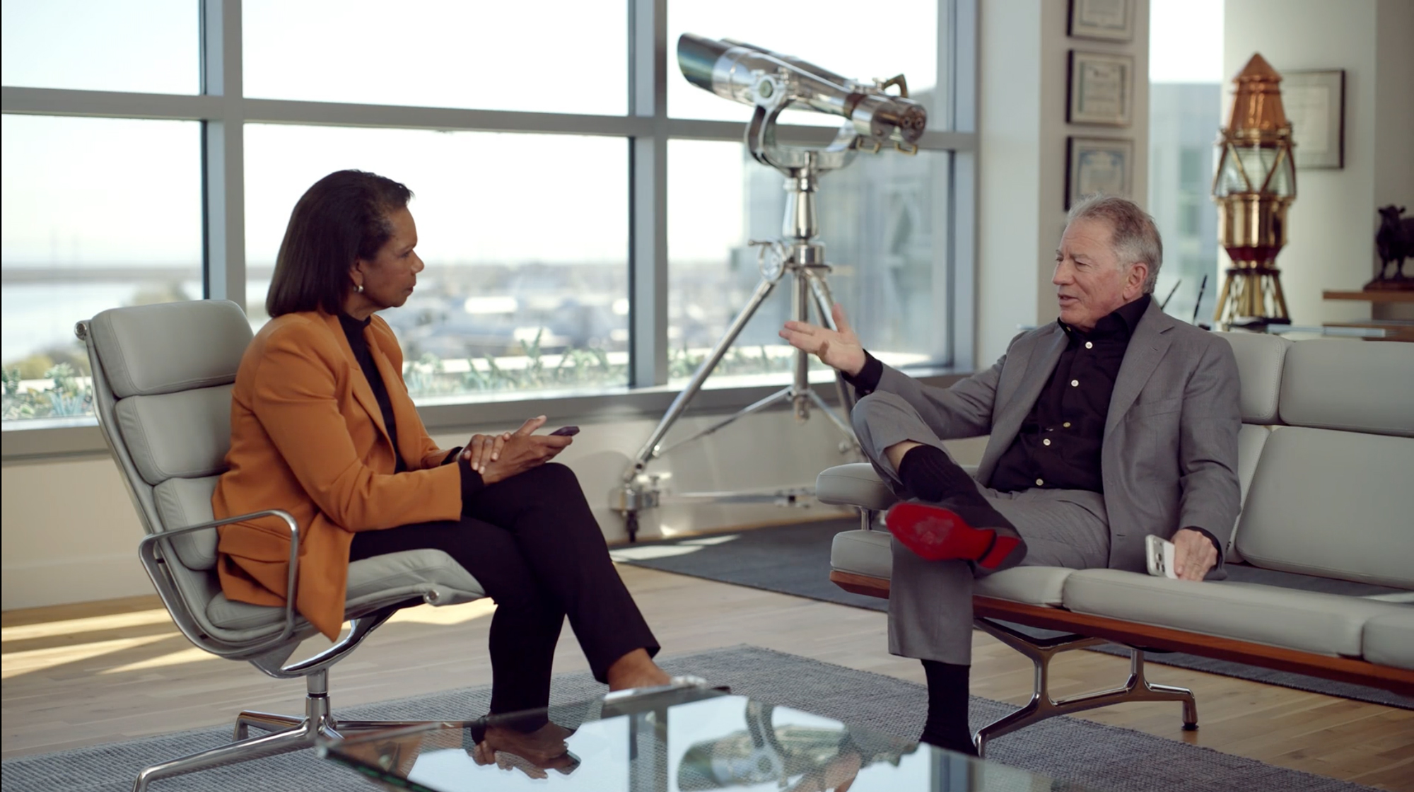 Tom Siebel speaks with Condoleezza Rice in his office at C3 AI.