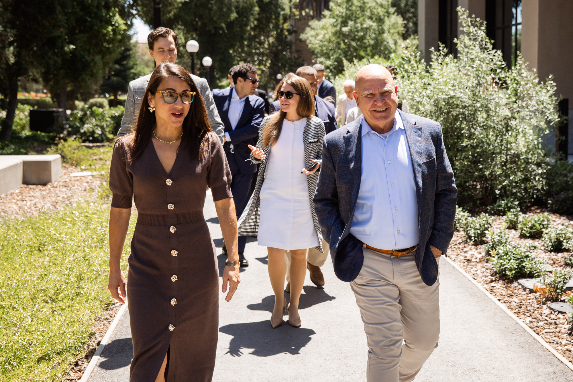 Senior Fellow H.R. McMaster walks with participants in the 2026 Hoover Institution International Seminar on Stanford’s campus on June 23, 2026 (Patrick Beaudouin)
