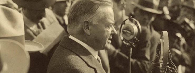 Detail of sepia tone photograph of Herbert Hoover speaking into microphones