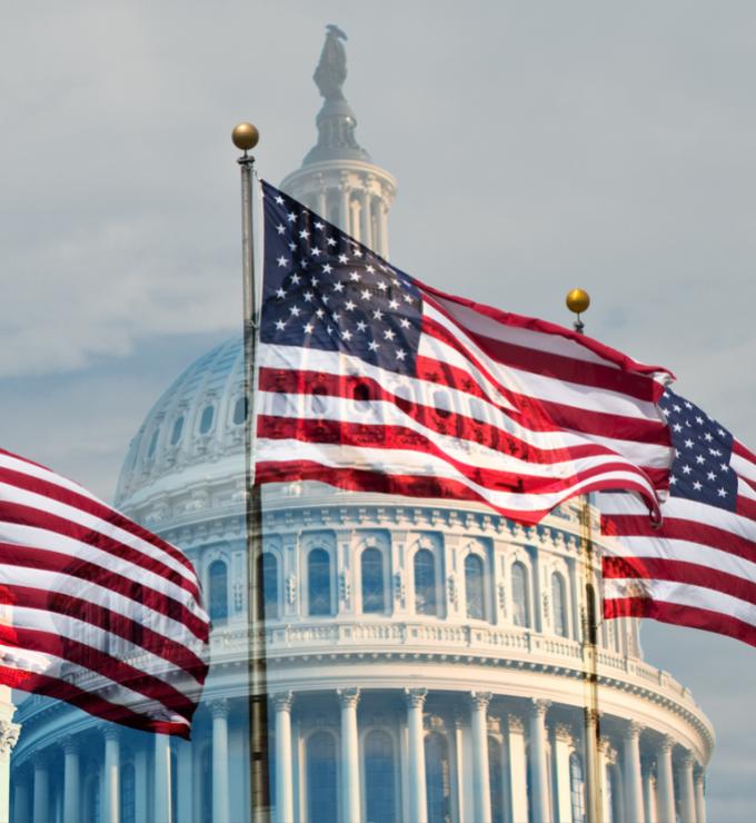 Capitol building with flags