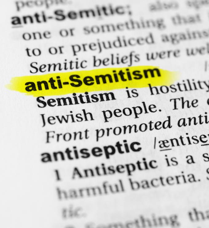 Highlighted English word "anti semitism" and its definition in the dictionary - stock photo
