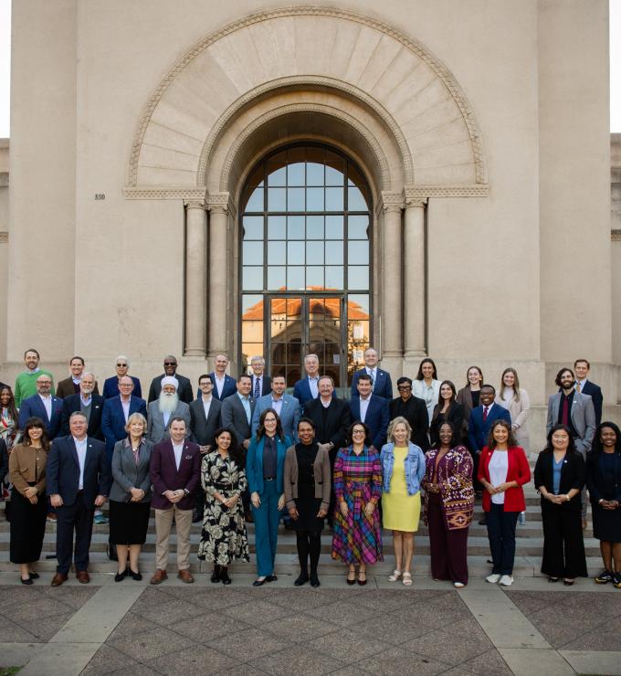 Participants in a joint Hoover–National Association of Counties gathering stand in front of Hoover Tower on December 8, 2025. (Patrick Beaudouin)