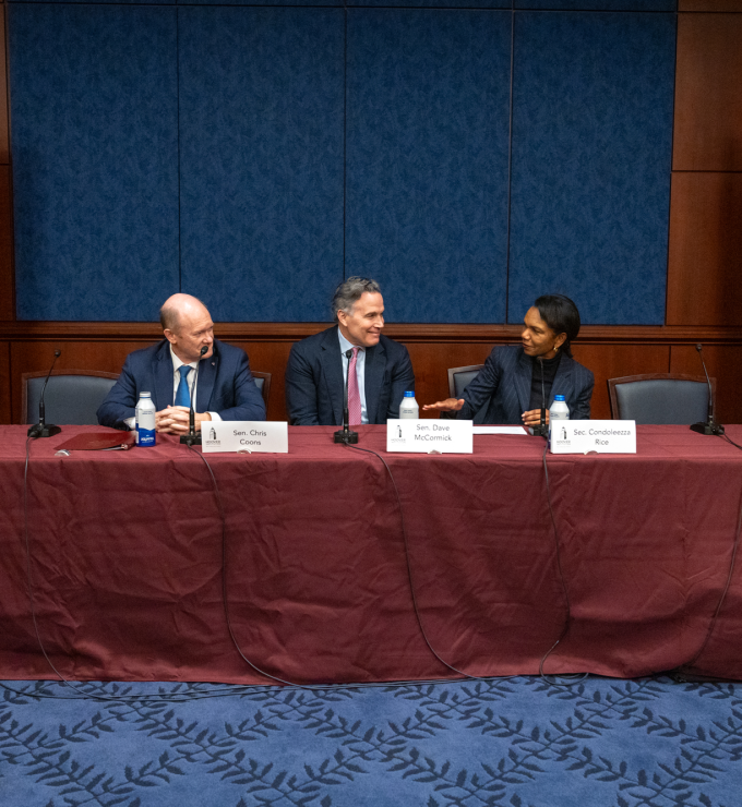 Director Rice, Senators Coons, and McCormick in conversation during their panel session.