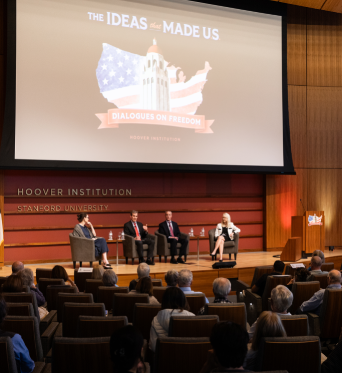 (From left to right) Washington Post columnist Megan McArdle and senior fellows John Cochrane, Ross Levine and Valerie Ramey speak about America’s future economic prospects in Hauck Auditorium on May 12, 2026. (Patrick Beaudouin)
