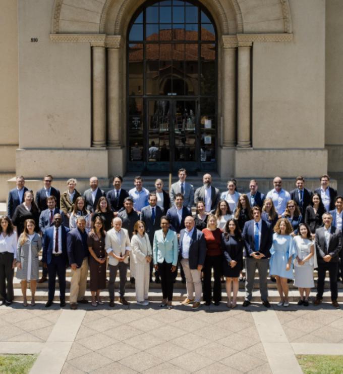 Participants in the 2026 Hoover Institution International Seminar stand with Condoleezza Rice before Hoover Tower on June 23, 2026. (Patrick Beaudouin)