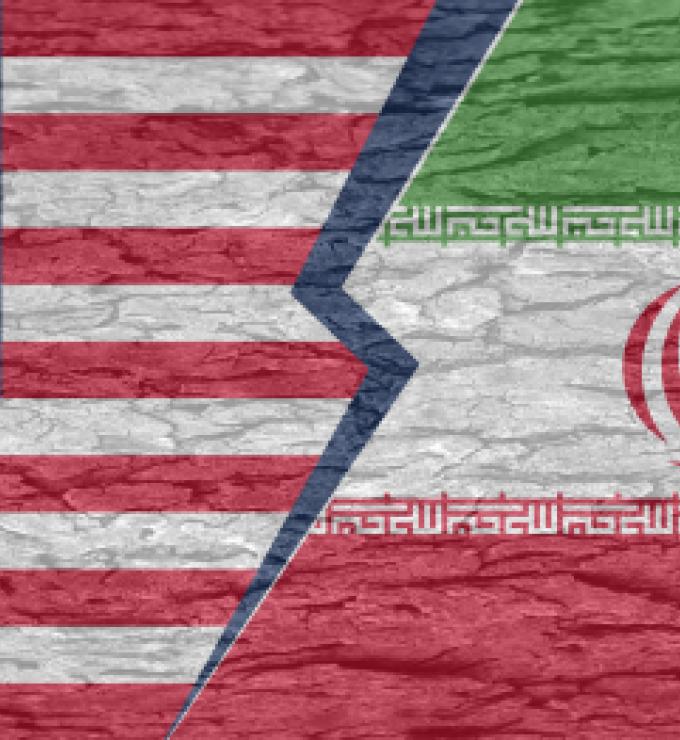 Severed ground separating the countries of america and iran on a cracked surface - stock illustration