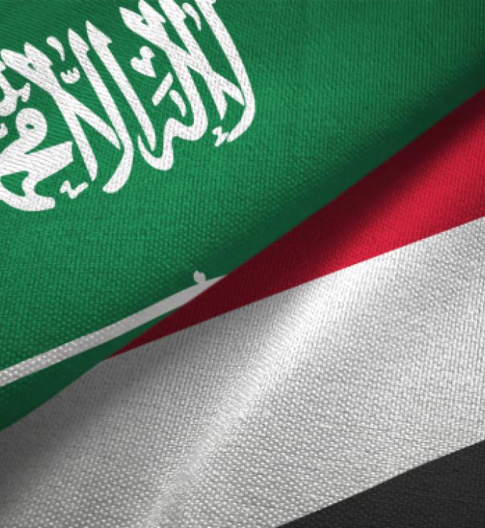 Yemen and Saudi Arabia two flags together textile cloth, fabric texture stock photo