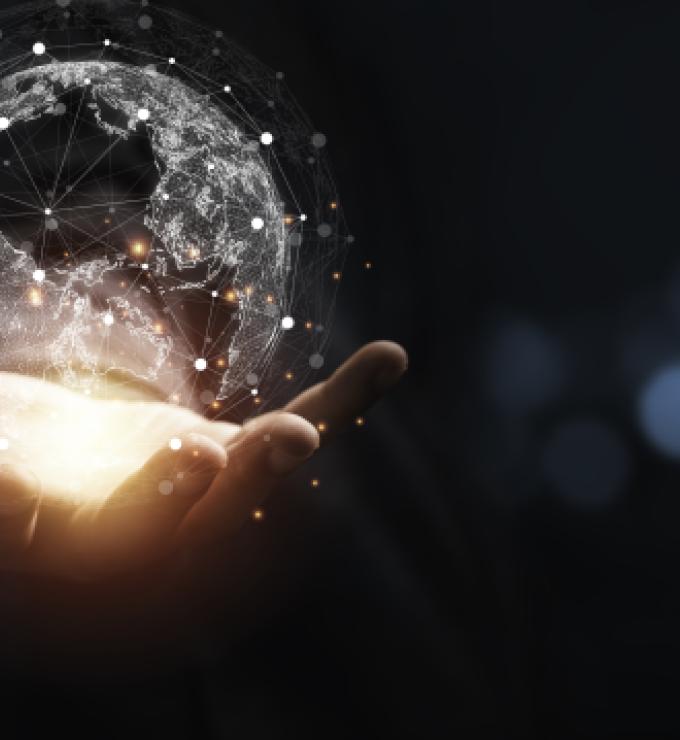 Hand holding virtual world with copy space and blue bokeh background for technology information and transformation concept. stock photo