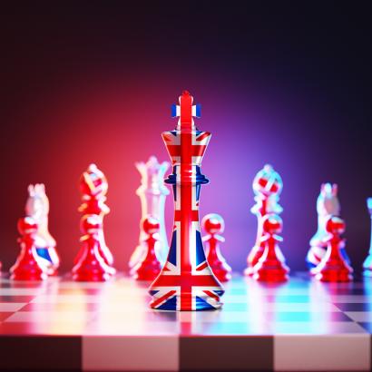 Flag of United Kingdom chess king on a chessboard stock photo