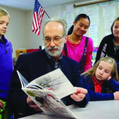 Huffman reading to schoolchildren