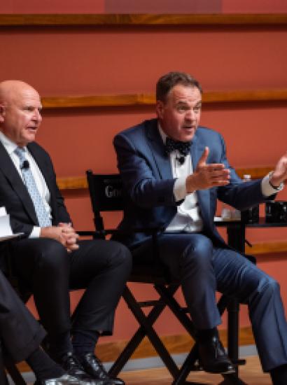 Senior Fellow and GoodFellows host Niall Ferguson gestures to the audience during a live taping of their podcast in Hoover’s Hauck Auditorium on April 22, 2026. (Patrick Beaudouin)
