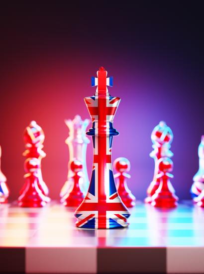 Flag of United Kingdom chess king on a chessboard stock photo