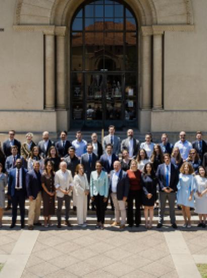 Participants in the 2026 Hoover Institution International Seminar stand with Condoleezza Rice before Hoover Tower on June 23, 2026. (Patrick Beaudouin)