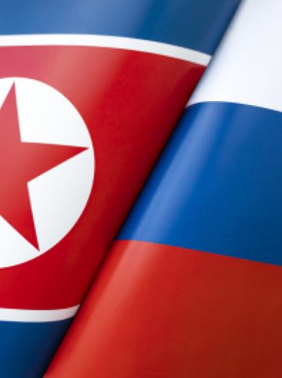 Background of the flags of the North Korea and Russia. The concept of interaction or counteraction between the two countries. International relations. political negotiations. Sports competition. stock photo