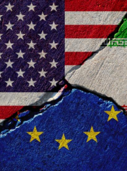 Concrete wall with painted united states, european union and iran flags stock photo