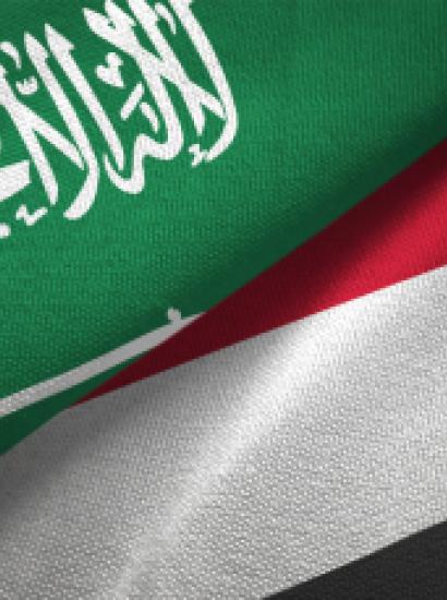 Yemen and Saudi Arabia two flags together textile cloth, fabric texture stock photo