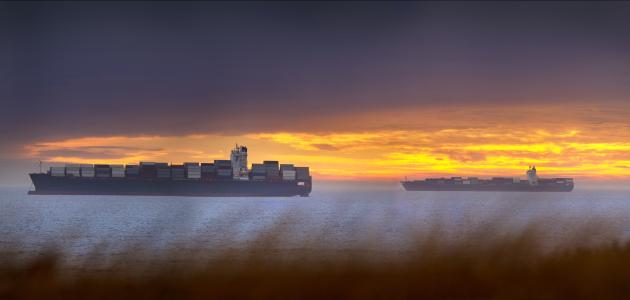 High resolution image of Container ships waiting to enter Cape Town harbour. - stock photo