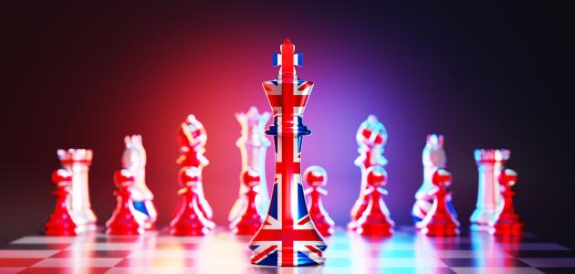 Flag of United Kingdom chess king on a chessboard stock photo