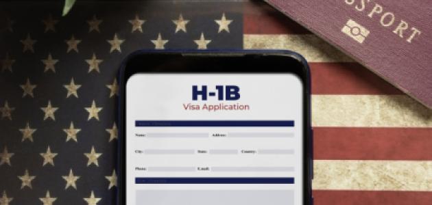 H-1b visa application concept: smartphone with USA H-1B visa application over a USA flag stock photo