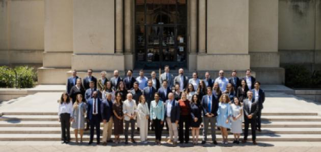Participants in the 2026 Hoover Institution International Seminar stand with Condoleezza Rice before Hoover Tower on June 23, 2026. (Patrick Beaudouin)