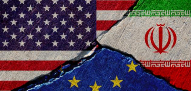Concrete wall with painted united states, european union and iran flags stock photo
