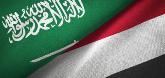 Yemen and Saudi Arabia two flags together textile cloth, fabric texture stock photo