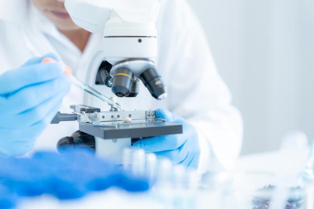 Scientist analyze biochemical samples in advanced scientific laboratory. Medical professional use microscope look microbiological developmental of viral. Biotechnology research in science lab. stock photo