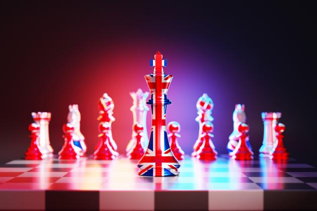 Flag of United Kingdom chess king on a chessboard stock photo