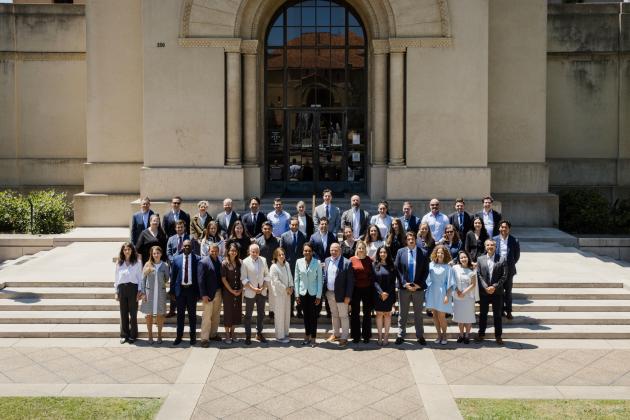 Participants in the 2026 Hoover Institution International Seminar stand with Condoleezza Rice before Hoover Tower on June 23, 2026. (Patrick Beaudouin)