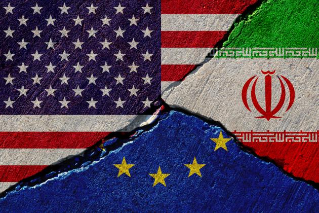 Concrete wall with painted united states, european union and iran flags stock photo