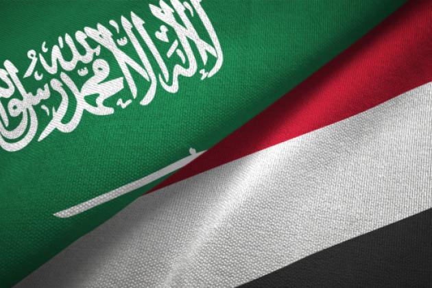 Yemen and Saudi Arabia two flags together textile cloth, fabric texture stock photo