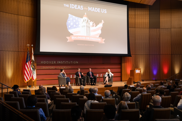 (From left to right) Washington Post columnist Megan McArdle and senior fellows John Cochrane, Ross Levine and Valerie Ramey speak about America’s future economic prospects in Hauck Auditorium on May 12, 2026. (Patrick Beaudouin)