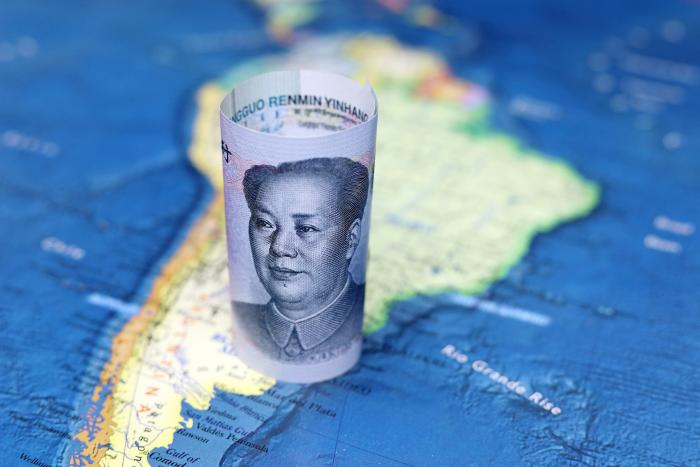 Chinese yuan on the map of South America - stock photo