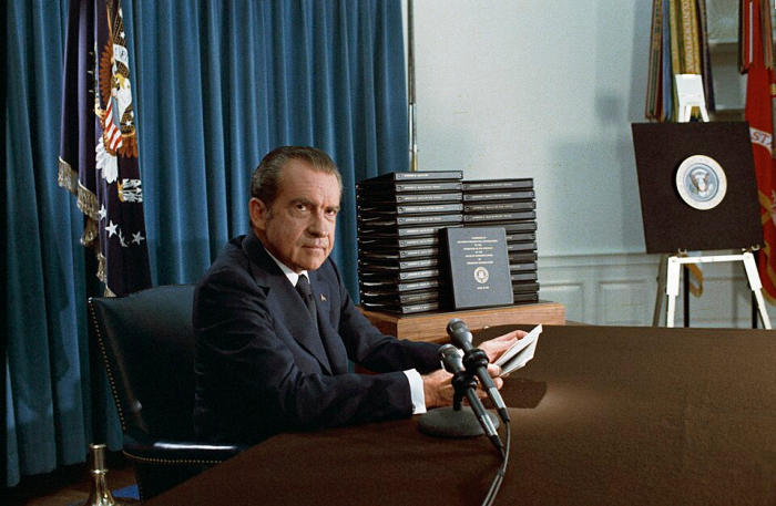 President Nixon, with edited transcripts of Nixon White House Tape conversations during broadcast of his address to the Nation.