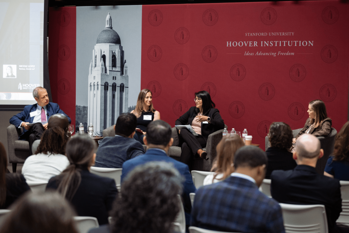 Senior Fellow Eugene Volokh (right), Katie Visser of Cloudflare, Ellie Sakahee of Google and Nicole Lopez of Orrick LLP are seen in Hoover’s Stauffer Auditorium on July 21, 2026.