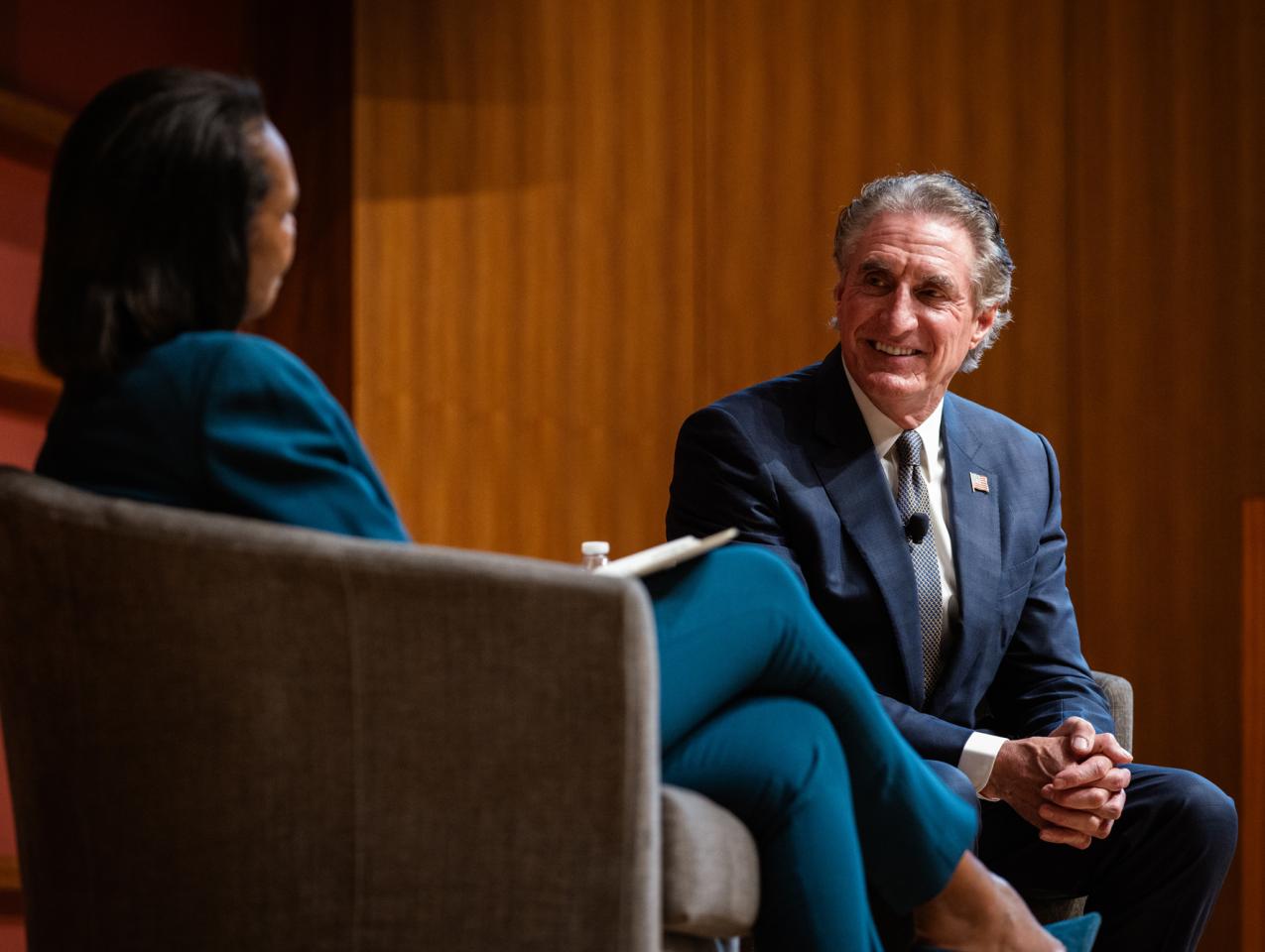 US Secretary of the Interior Doug Burgum is seen in Hauck Auditorium with Hoover Institution Director Condoleezza Rice on October 10, 2025. (Patrick Beaudouin)